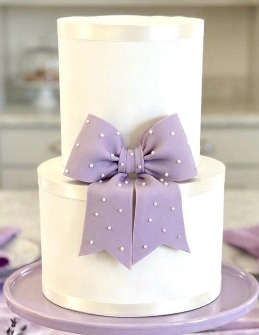 Big lavender fondant bow with pearl dots