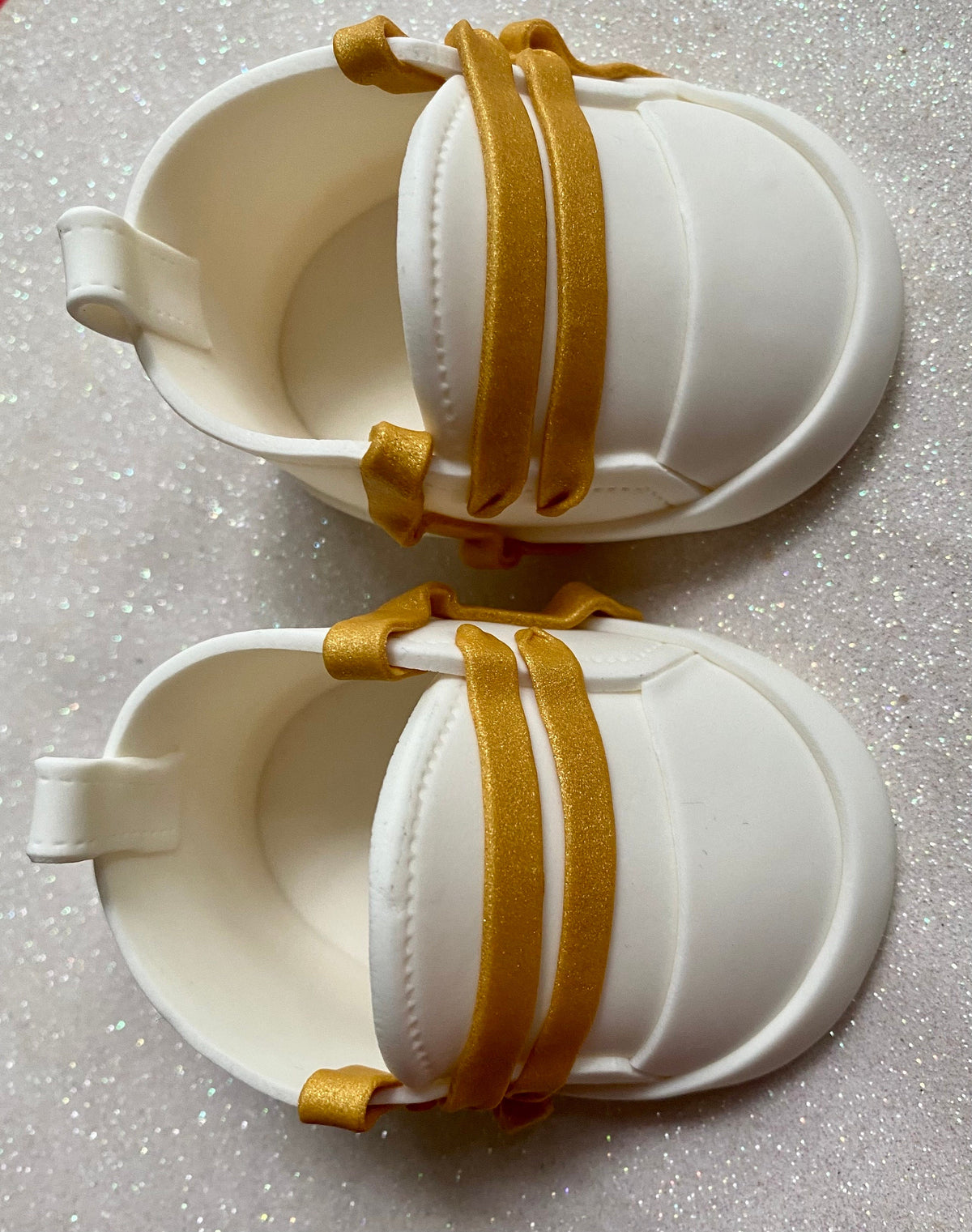 White fondant shoes with gold laces