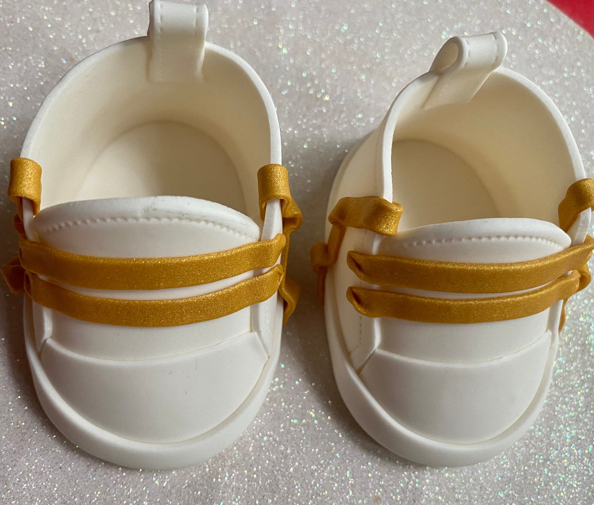 White fondant shoes with gold laces