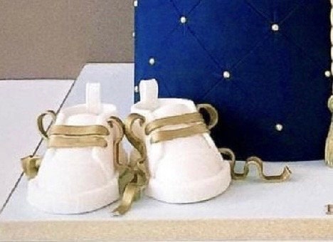White fondant shoes with gold laces