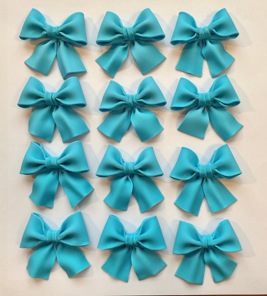 Set of 12 blue bows cupcake toppers.