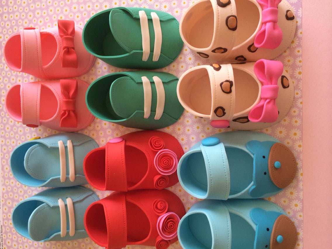 Baby shower cake toppper/ Pink baby girl shoes with small flowers gum paste fondant