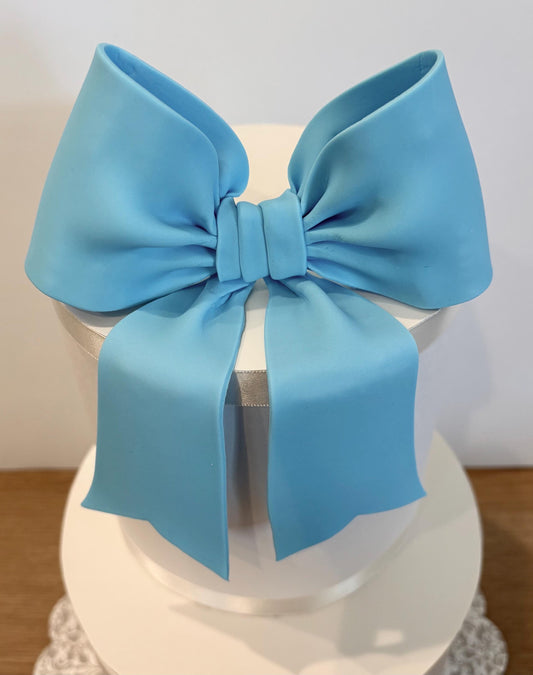 Big light blue fondant bow