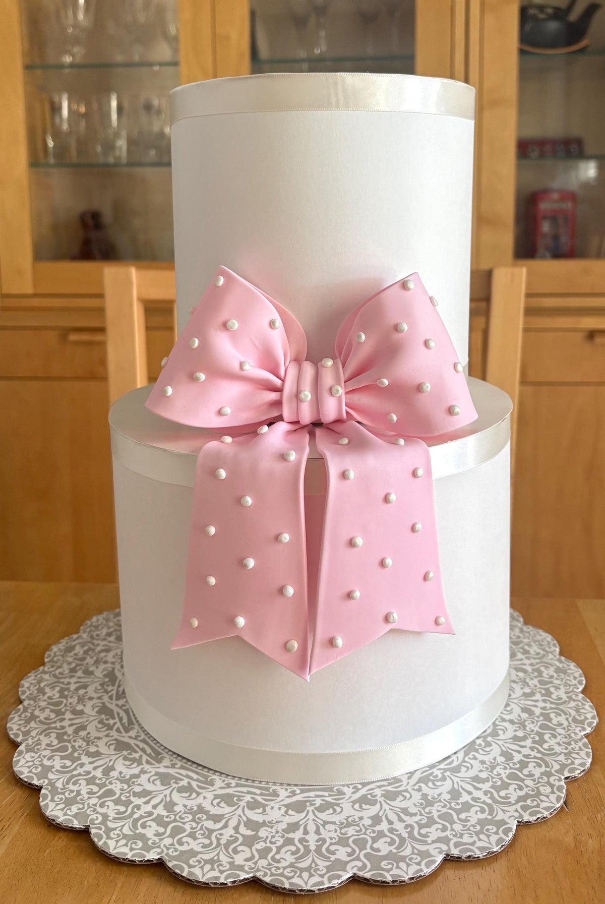Big light pink fondant bow with pearl dots