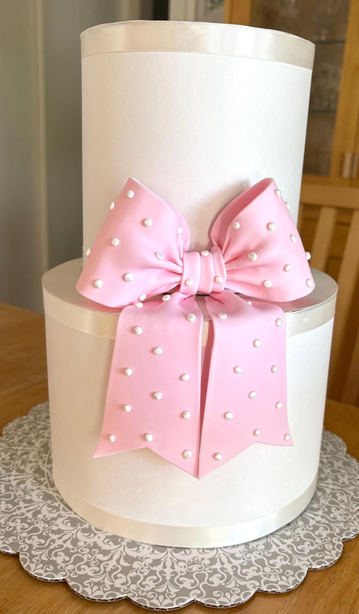 Big light pink fondant bow with pearl dots