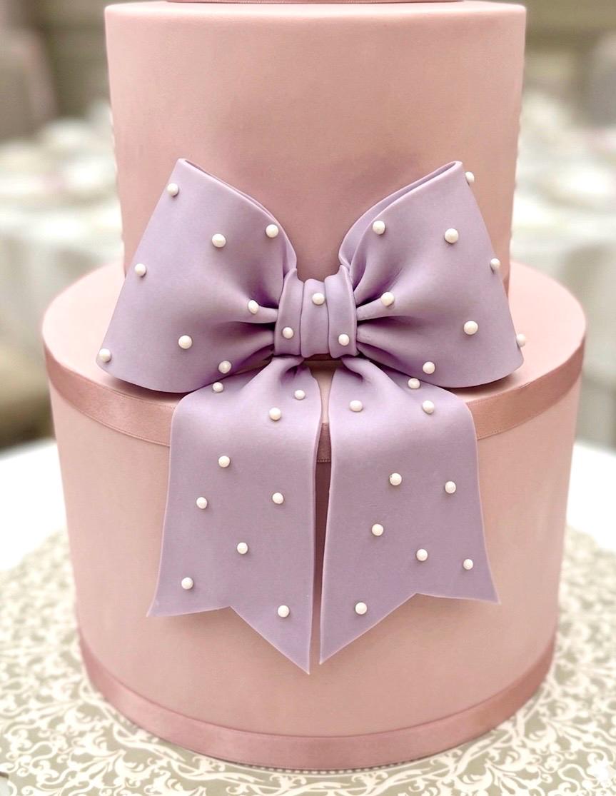 Big lavender fondant bow with pearl dots
