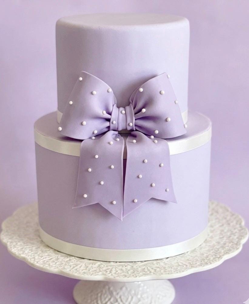 Big lavender fondant bow with pearl dots