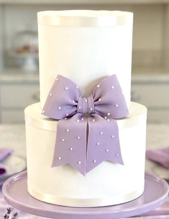 Big lavender fondant bow with pearl dots