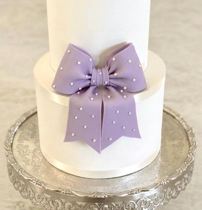 Big lavender fondant bow with pearl dots