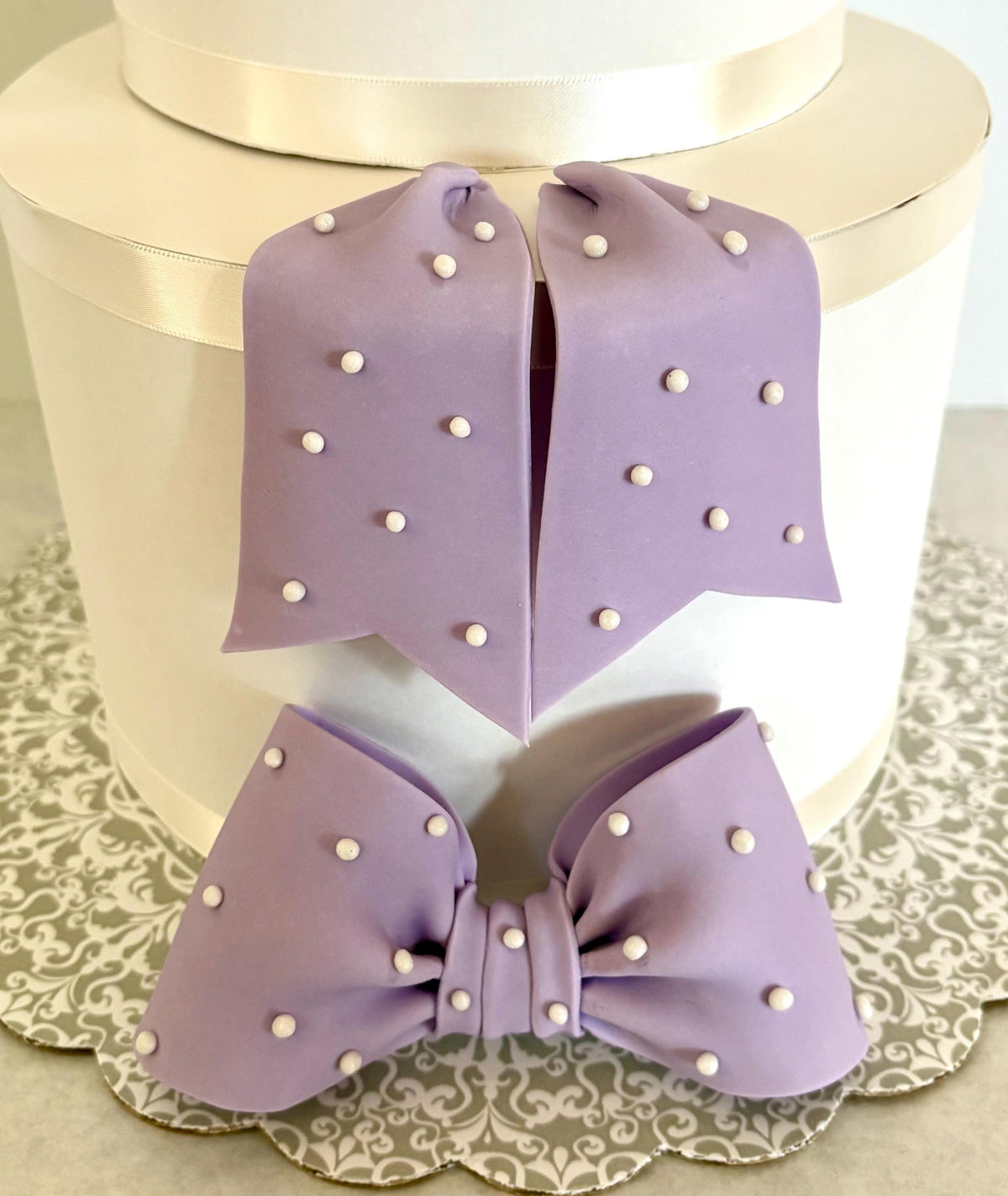 Big lavender fondant bow with pearl dots