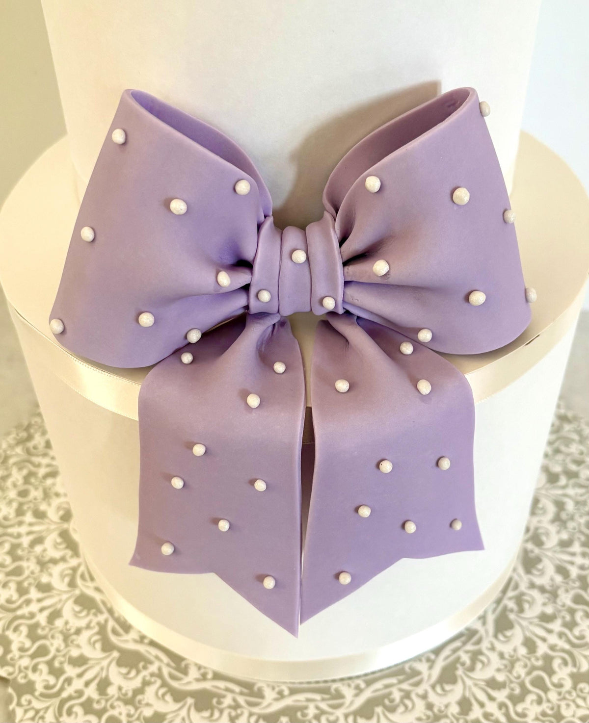 Big lavender fondant bow with pearl dots